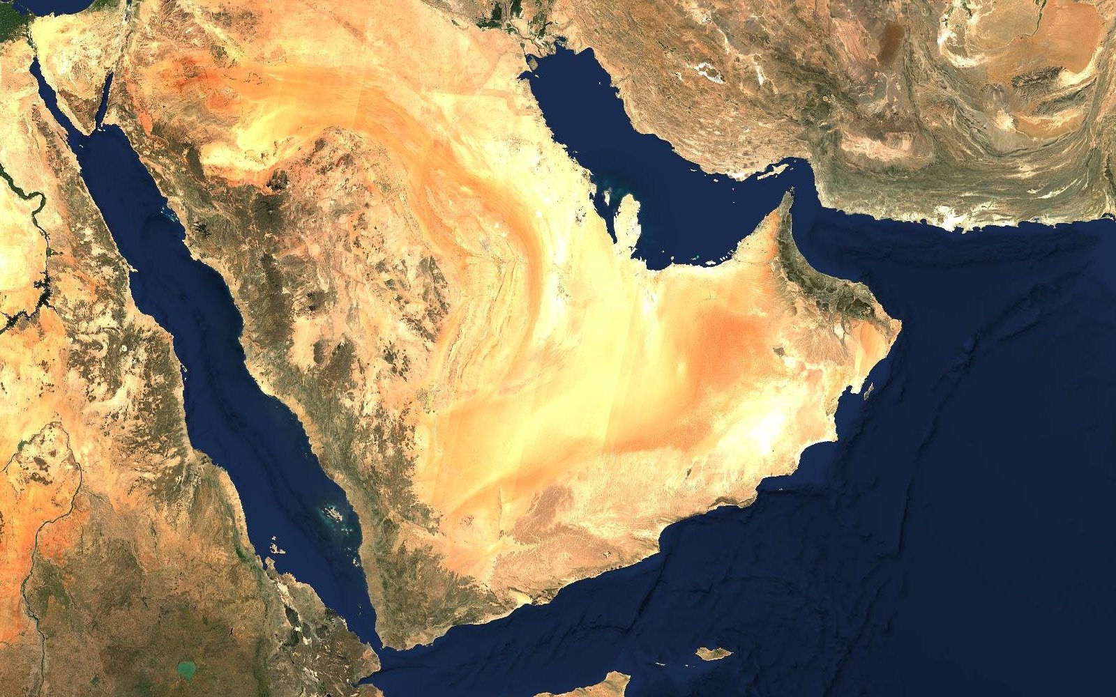 Satellite view of the Arabian Peninsula as it is today, sand deserts and dark mountains